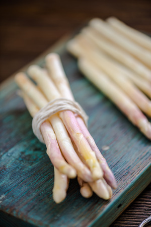 white asparagus steams on table, freshly clickedの写真素材