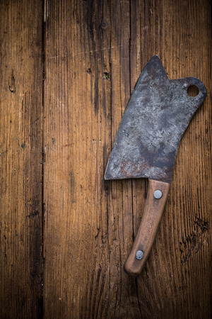 butcher vintage cleaver on wooden backgroundの写真素材