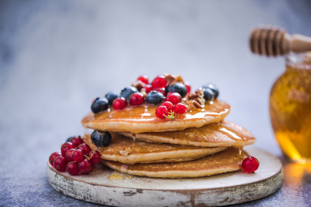 pancakes with redcurrant and berries, healthy brunch ideaの写真素材
