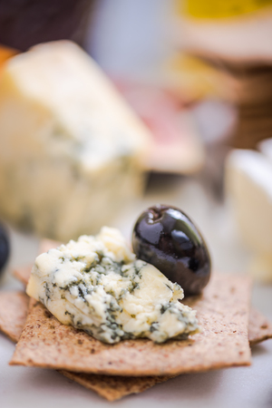 italian cheese selection with olives,grapes and figの写真素材