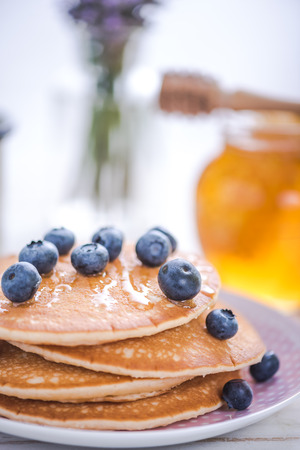 pancakes with blueberries and honey, healthy brunchの写真素材