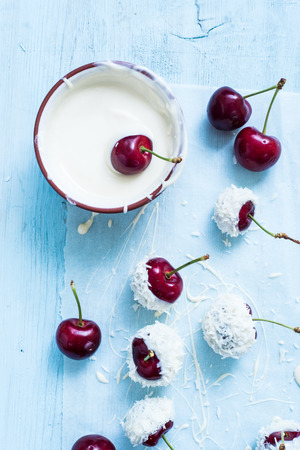 cherries in chocolate and coconutの写真素材