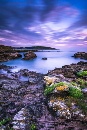 blurred long exposure sunset with dramatic weather