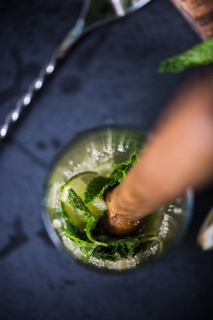 Preparing Cuban Mojito cocktail, close view from aboveの写真素材