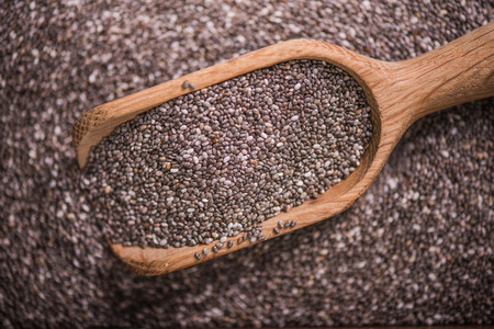 Heathy Chia seeds with wooden spoon, overhead viewの写真素材