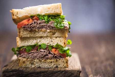 Stack pile of sandwich for brunch on wooden boardの写真素材