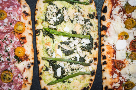 different healthy pizza, overhead view