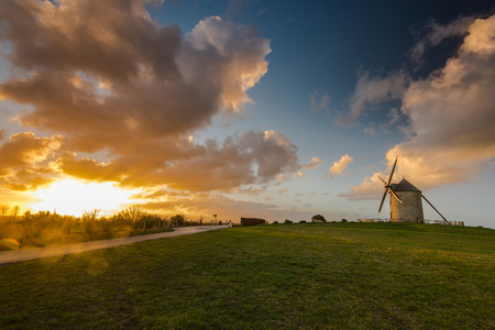 Taditional ancient windmill Moidrey in scenic fields on hill top in Pontorson,France.の写真素材