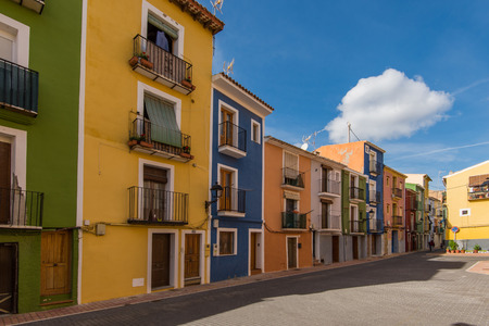 Traditional colorful facades in Villajoyosa in Spain. Famous tourist destination.の写真素材