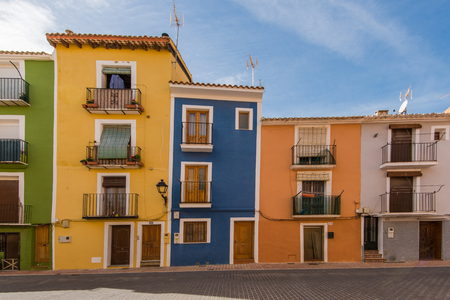 Traditional colorful facades in Villajoyosa in Spain. Famous tourist destination.の写真素材