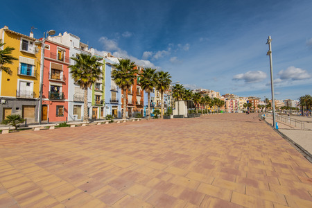 Promenade and beach in colorful village of Villajoyosa in Spain on Costa Blancaの写真素材