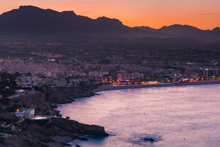 Illuminated Costa Blanca Albir town at twilight, filtered effect.の写真素材