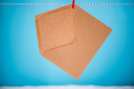 Letter to Santa Claus hanging on line.