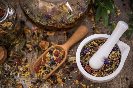 Making tea from loose tea and herbal ingredients.の写真素材