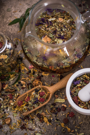 Making tea from loose tea and herbal ingredients.の写真素材
