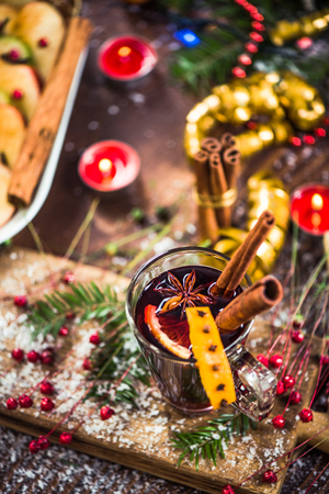 Red mulled hot wine in glass with spices.の写真素材