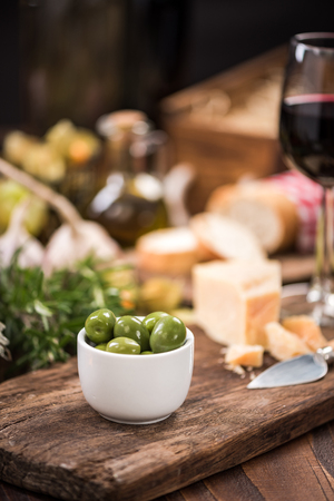 Green olives in bowl,spanish tapa bar food.の写真素材