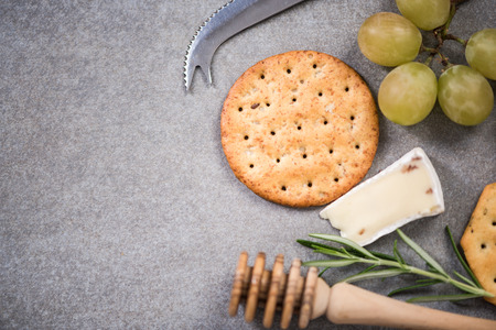 Cheese border background,mockup food frame. Overhead on stone slate.の写真素材