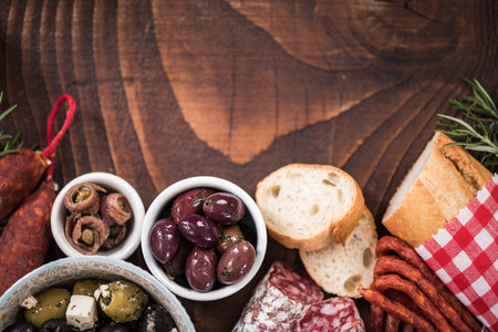 Authentic spanish tapa on wooden bar table. Food for sharing.の写真素材
