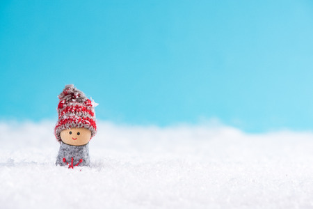 Little boy smiling in snow.の写真素材