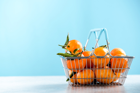 Shopping basket ful of oranges.の写真素材