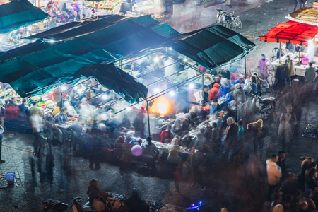 Busy food stall with motion blur at Jamaa El Fna market square in MEdina,Marrakesh,Moroccoのeditorial素材