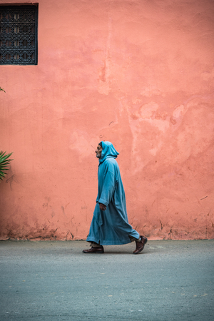 Marrakech,Morocco - January 2018: Man in Berber traditional clothing walking on street in Marrakeshのeditorial素材