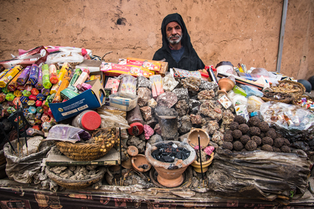 Marrakech,Morocco - January 2018:Old man selling incense on street stall in Marrakesh.のeditorial素材
