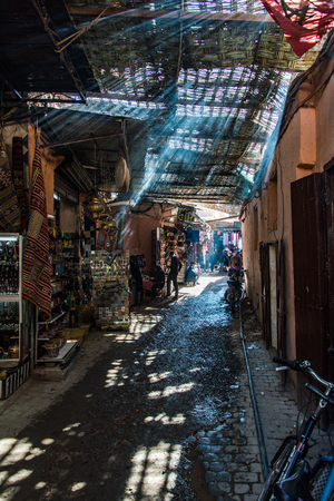 Marrakech,Morocco - January 2018:Locals and tourist walking in narrow street in Marrakeshのeditorial素材