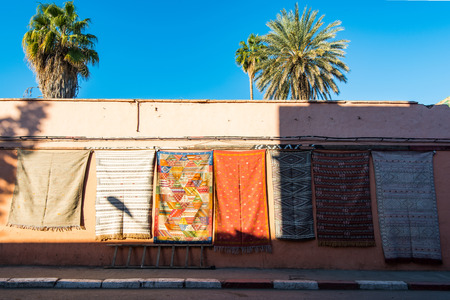 Carpets for sale on the wall in Morocco.の写真素材