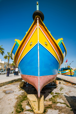 Traditional painted fisherman boat in Marsaxlokk village,Malta.のeditorial素材