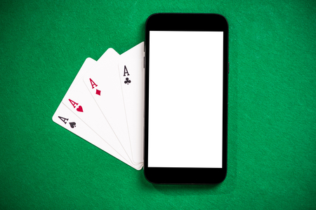 Playing casino games and poker on mobile phone.