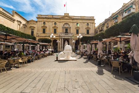 VALLETTA, MALTA - MARCH , 2018: Tourist and locals sitiing in cafe enjoying sunny day.のeditorial素材
