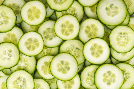 Cucumber slices, full frame food background. Close up top view.の写真素材