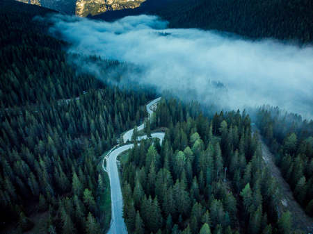Alpine asphalt road from aerial drone view.の写真素材