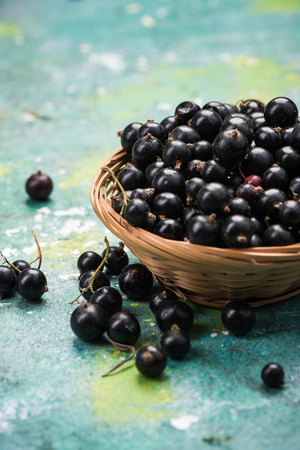 Fresh ripe blackcurrant in basket.の写真素材