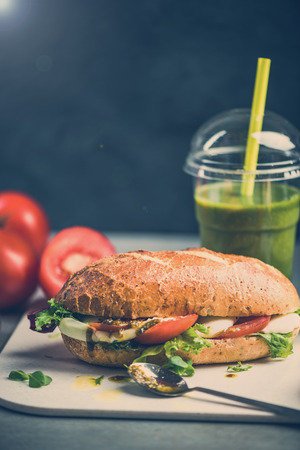 Diet vegetarian sandwich bun with smoothie, breakfastの写真素材