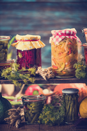 Preserved food, marinated fermented and pickled vegetables in jarsの写真素材