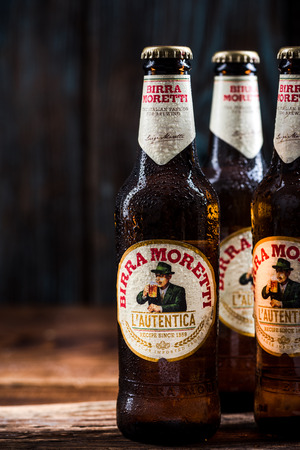 TARNOW, POLAND - SEPTEMBER 24, 2018:  Frozen bottles of Italian beer Birra Moretti, product still life.のeditorial素材