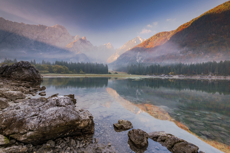 Panoramic view at sunrise over alpine lake in Italy.の写真素材
