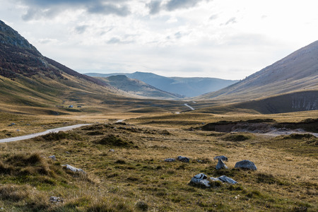 Road till horizon, rural stepe and curvy hills,Bosnia.の写真素材