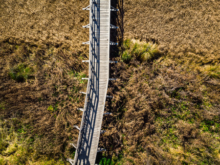 Wooden bridge over dry grassland,aerial view. Zelenci,Slovenia.の写真素材