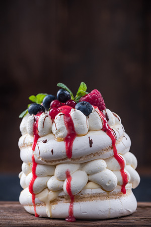 Traditional pavlova dessert with berry fruits.の写真素材