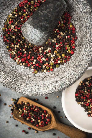 Peppercorn seed in granite mortar or pestle.の写真素材