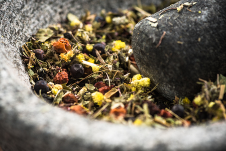 Mixed dry herbs in mortar or pestle,healthy herbal tea.の写真素材