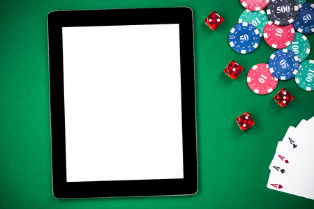 Empty tablet screen on poker table, on line casino template.の写真素材