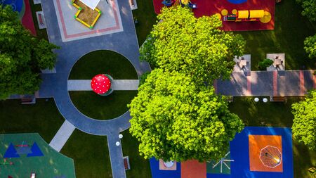 Abstract And Creative Drone Top Down View over Kids Playground in Park.