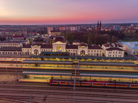 Tarnow train station illuminated at evening, aerial drone view.のeditorial素材