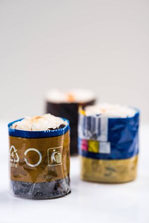 Sushi Wrapped in Plastic. Ocean Pollution And Environmental Conservation Concept.