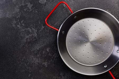 Steel Frying Pan, Top View, Dark Background with Copy Space.の写真素材